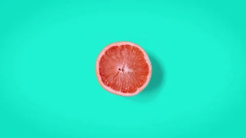 Stop motion animation Top view on grapefruit half rotating Stock Footage 135417548