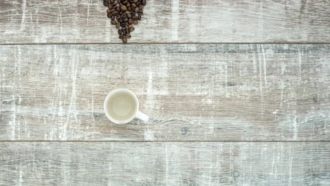 Stop motion animation of transformation roasted coffee beans to cup of coffee Stock Footage 105060822