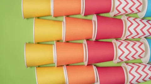 Stop motion animation. Yellow, red, blue paper cups for coffee move Video stock 169636031
