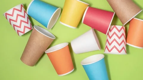 Stop motion animation. Yellow, red, blue paper cups for coffee Video stock 169987241
