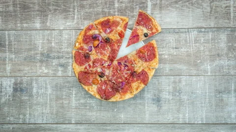 Stop motion of appearance of fresh pizza on a wooden table Stock Footage 104858550