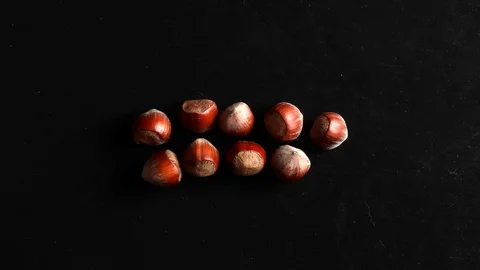 Stop motion background animation with hazelnuts on slate Stock Footage 125204174
