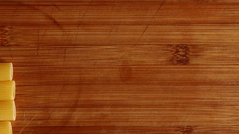 Stop motion background animation with rigatoni on chopping block Stock Footage 125204170