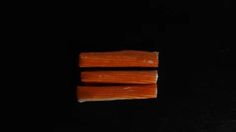 Stop motion background animation with surimi sticks on slate Stock Footage 125204189