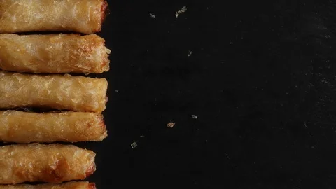 Stop motion background animation with vietnamese spring rolls on slate Stock Footage 125204168