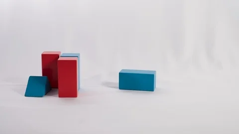 Stop motion of blocks being moved and arranged in stack, in white background. 動画素材 95641760