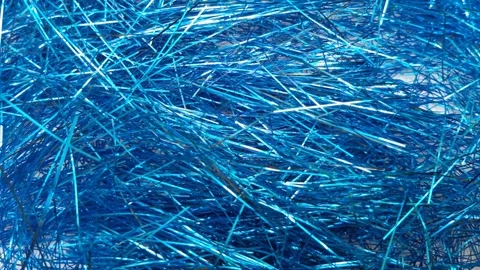 Stop motion Blue foil tinsel background, Shimmer shiny blue tinsel shred festive Video stock 321861702