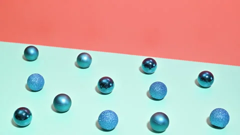 Stop Motion of Blue Ornaments Emerging on contrast Blue-Orange Background Stock-Footage 256111967