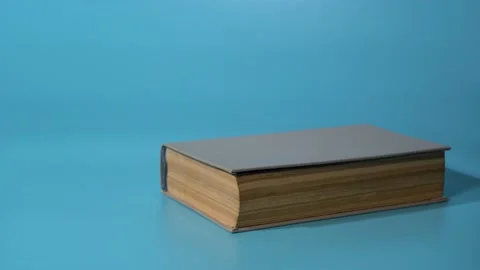 Stop motion books are placed on top of each other on a blue background. Stock Footage 146786787
