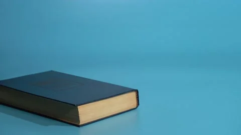 Stop Motion Books Are Placed One On Another On A Blue Background Stock Footage 147850127