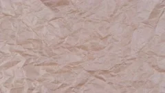 Wrinkle pink paper texture in rotation, Stock Video