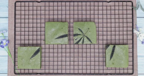 Stop motion of cannabis matcha cake. Stock Footage 159081137