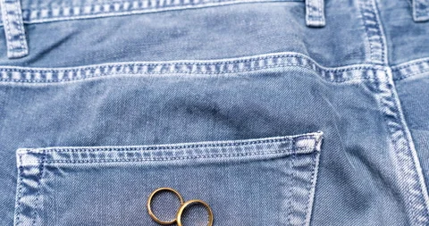 A stop-motion clip featuring two wedding rings spinning gracefully as they emerg Stock Footage 284235867