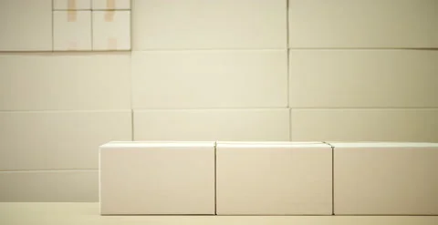 Stop-motion clip of many blank cardboard boxes making up a wall Stock Footage 135273778