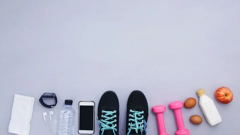 Stop motion - close up of objects for exercise on gray background Stock Footage 98437819