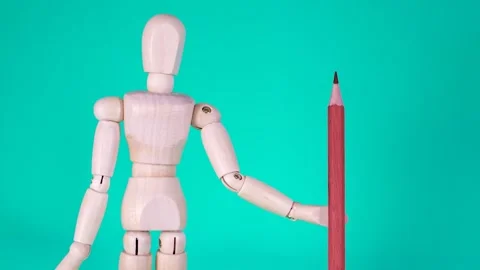 Stop Motion Closeup Of Wood Man's Hand Holding A Pencil That Changes Colors. Stock Footage 169787021