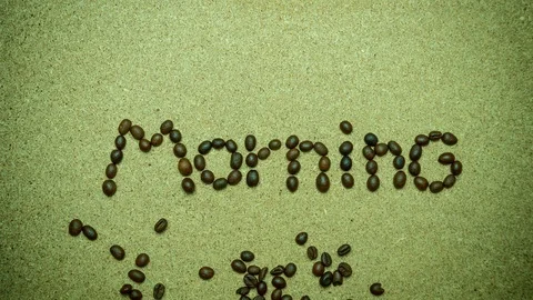 Stop motion coffee bean moves as “Good morning" and the sun shape. Stock Footage 104807395