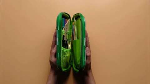 Stop motion of colored school pencil case with school supplies Stock Footage 205546786