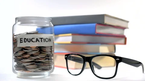 Stop motion concept of saving money for education Stock Footage 126637242