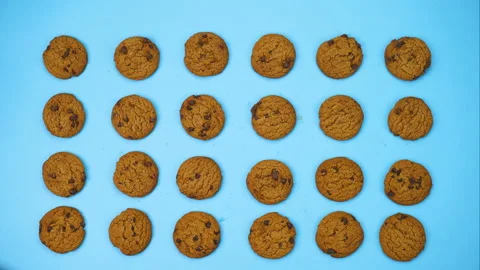 Stop motion cookies dancing on blue background Stock Footage 141451650