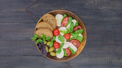 Stop motion of cooking of caprese salad with tomatoes and mozzarella cheese Stock Footage 146368941