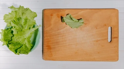 Stop motion cooking salad from fresh vegetables, flat lay. Animation top view Stock Footage 101233316