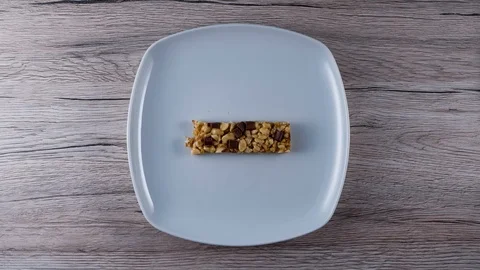 Stop Motion cornflake bar on a white plate Stock Footage 111512999