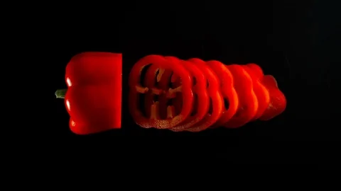STOP MOTION: Cutting A Fresh Red Bell Pepper On A Black Surface Видео 115958402