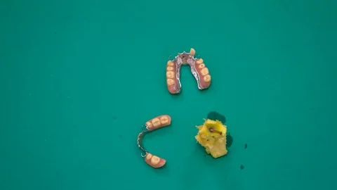 Stop motion of dental prosthesis in motion eating a apple Stock Footage 116302156