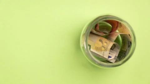 Stop motion different euro banknotes placing into the bottle. Stock Footage 162619770