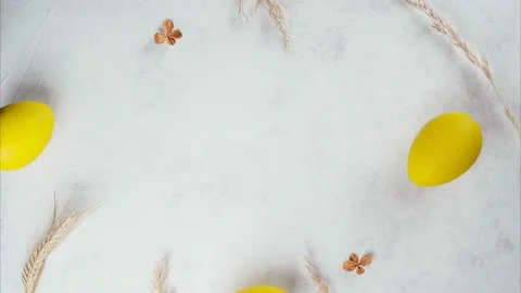 Stop motion Easter video of appearing yellow eggs, cereals, toy bunny, cardboard Stock Footage 172807879