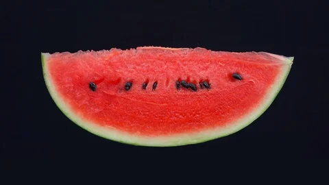 Stop motion, Eating slice of watermelon  isolated on black background Stock Footage 125577791