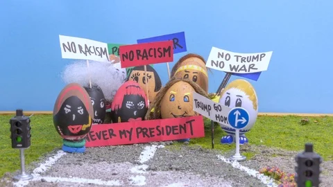 A stop-motion of eggs during a manifestation against the president Donald Trump Video stock 89902860