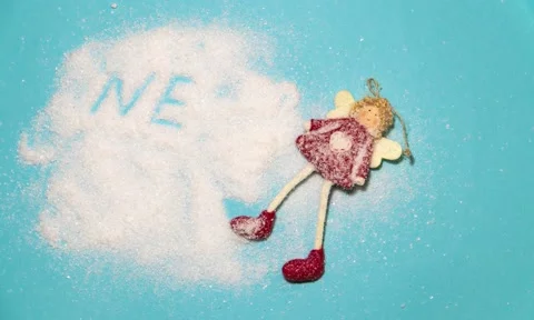 Stop motion. The emerging inscription New Year with a New Year's Christmas toy Stock Footage 220681347