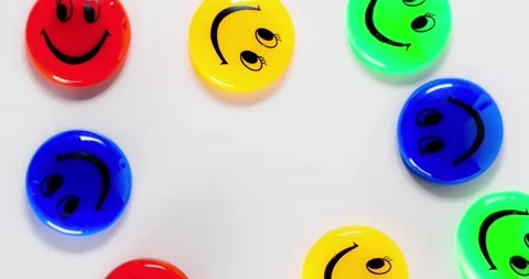Stop motion emoticons. Group of multicolored emoticons moving on a white backgro Stock Footage 146040688