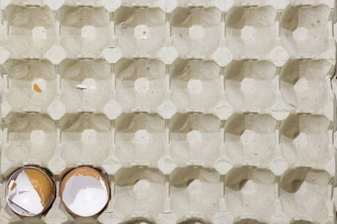 Stop motion flat lay of a box with broken eggshell brown chicken eggs Stock Footage 130000176