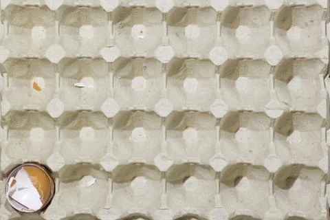 Stop motion flat lay of a box with broken eggshell brown chicken eggs Stock Photos