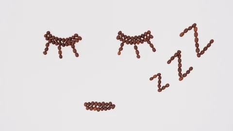 Stop motion footage of coffee beans in shape of animated human face Stock Footage 102187867
