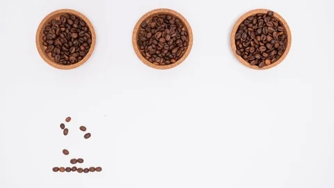 Stop motion footage of coffee beans in shape of cup, hart and bean. Stock Footage 102189494