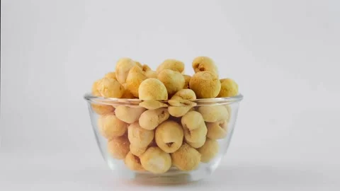 Stop motion of Freeze Dried Longan in a glass bowl on white background. Stock Footage 220324153