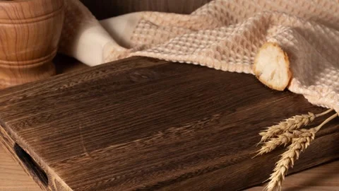 Stop motion of fresh bread slices disappearing and appearing at wooden board. Stock Footage 302846258
