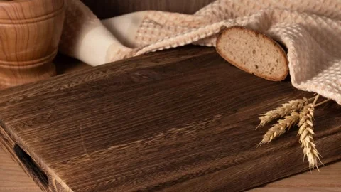 Stop motion of fresh bread slices disappearing and appearing at wooden board. Stock Footage 302920114