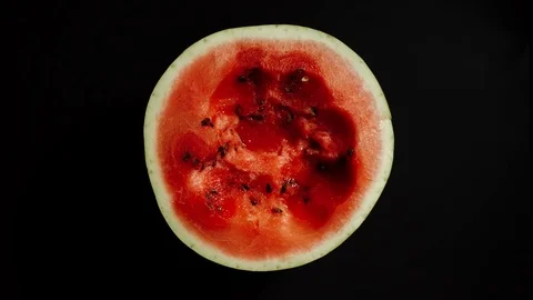 STOP MOTION: Half Of Fresh Watermelon Is Eaten Up On ABlack Background Vídeo Stock 113990684