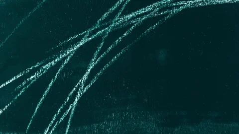 Stop motion of hand drawing scribble and lettering The End on green chalkboard. Video stock 81515419