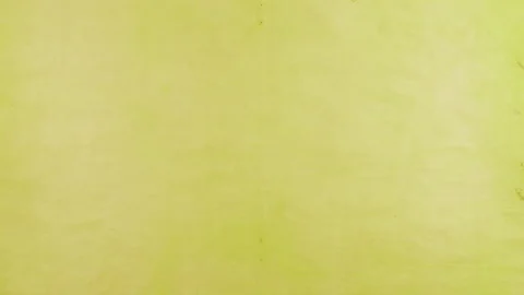 Stop motion of handmade recycled paper sheets in warm yellow, green, pink, peach Stock Footage 330275336
