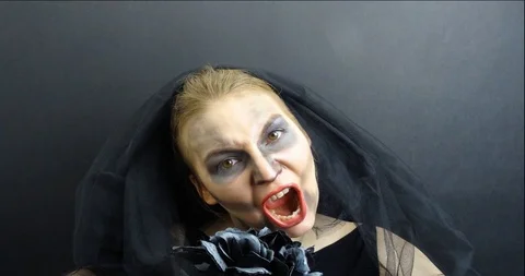 Stop motion of the horrible corpse bride / widow with the bride's bouquet Stock Footage 93051029