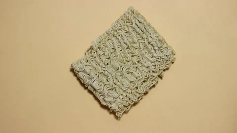 Stop motion: Instant noodles are first whole and then broken Stock Footage 136666446