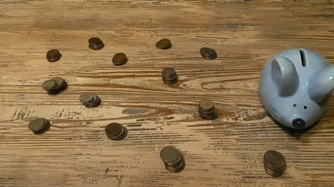 Stop Motion. Loop video. Blue piggy bank in the form of a mouse on wood floor Stock-Footage 120643796