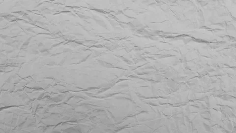 Stop motion looping animation of white crumpled paper texture background. Stock Footage 168966581