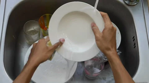 Stop motion man hand wash dishes and glass Stock Footage 36467524